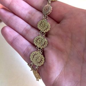 Choker necklace with flower design.